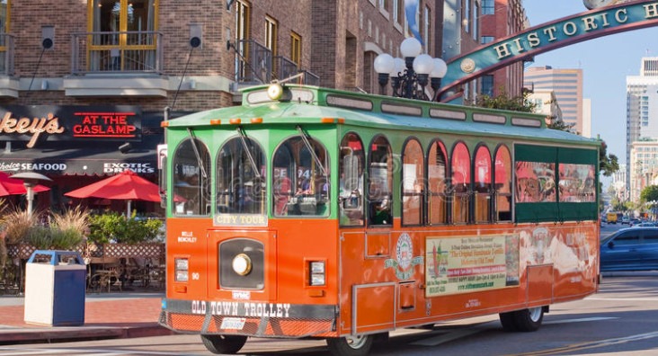 a vibrant red and green trolley